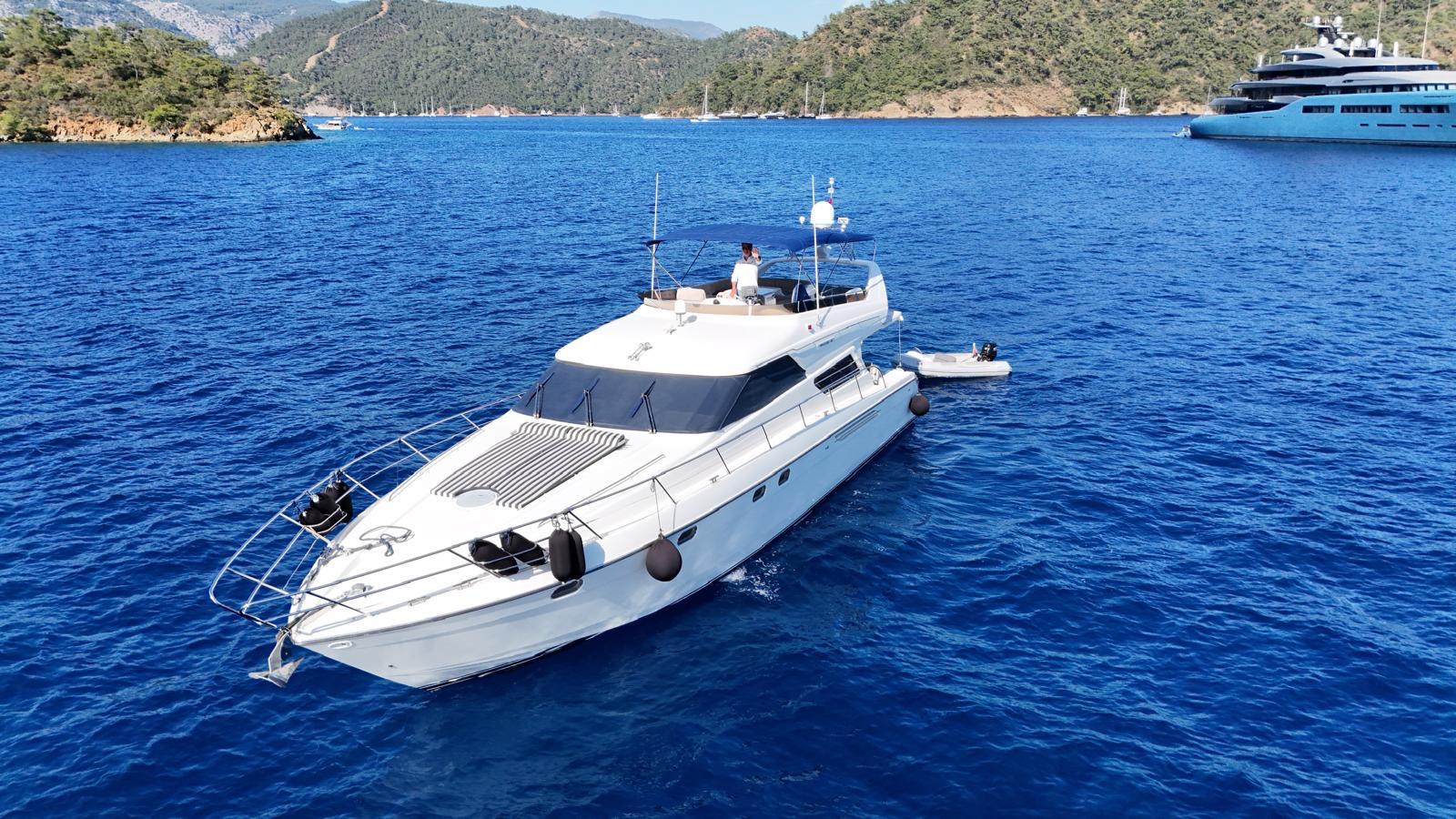 EXCELSIOR anchored in clear blue water